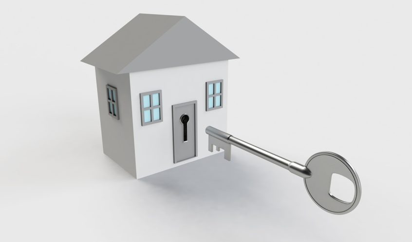 A large key fits the door lock - an invitation to work with Tina Vincent Real Estate Agent